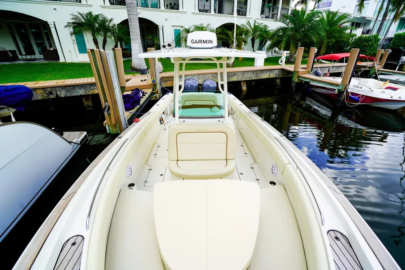 Tender Offer Yacht Photos Pics 2008 Chris-Craft Catalina 29 boat docked, featuring Garmin equipment, surrounded by water and greenery.