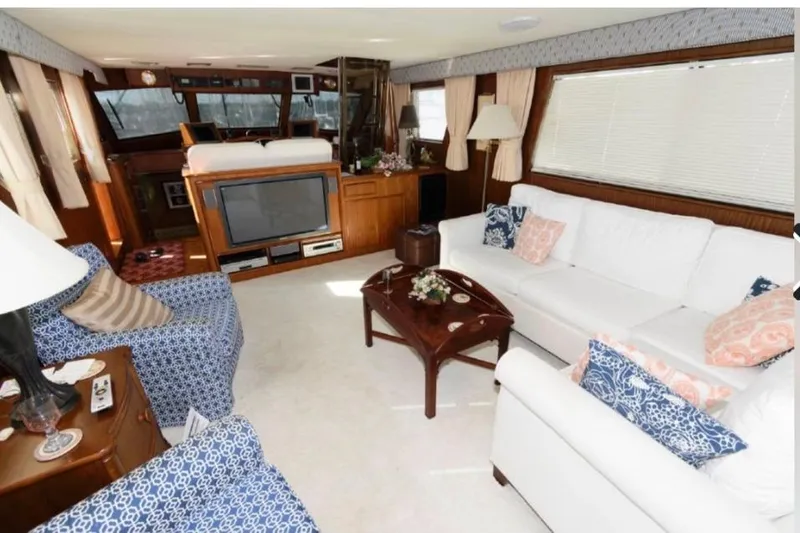  Yacht Photos Pics Luxurious interior of 1988 Hatteras 54 Motor Yacht with elegant seating and decor.