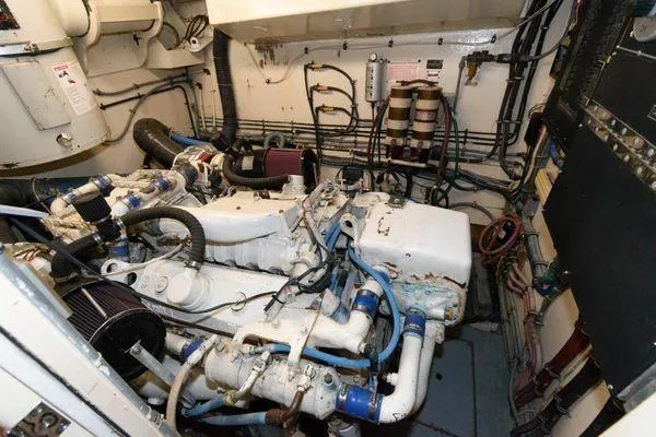  Yacht Photos Pics Engine room of 1988 Hatteras 54 Motor Yacht, showcasing mechanical components and wiring.