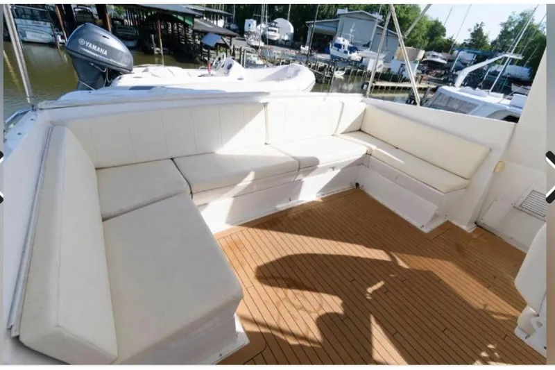  Yacht Photos Pics 1988 Hatteras 54 Motor Yacht with spacious outdoor seating and teak deck.