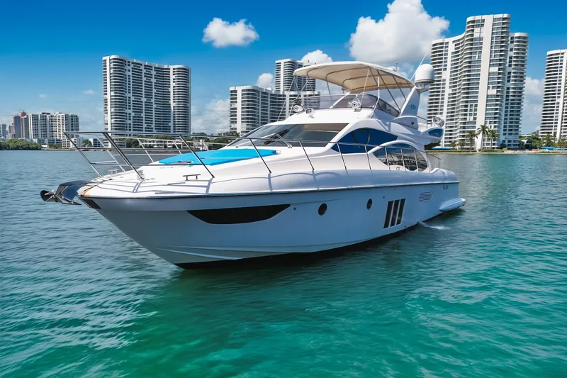 Ll On The Rocks Yacht Photos Pics Azimut Fly 53 yacht from 2012 on water with city skyline background.