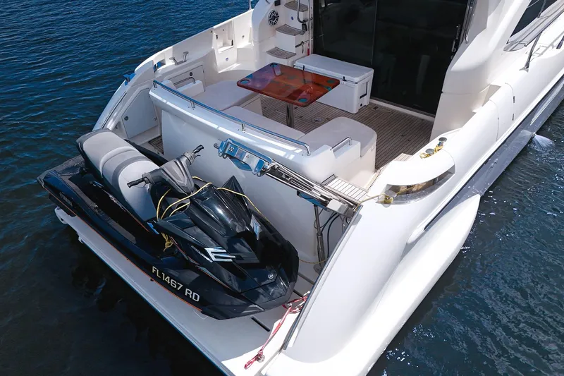 Ll On The Rocks Yacht Photos Pics Azimut Fly 53 yacht with jet ski on deck, 2012 model, docked on water.