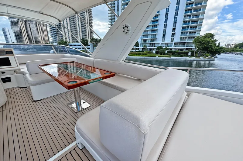 Ll On The Rocks Yacht Photos Pics Luxurious Azimut Fly 53 yacht deck with elegant seating and table, 2012 model.