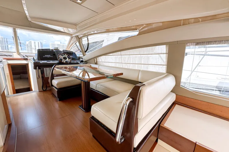 Ll On The Rocks Yacht Photos Pics Luxurious interior of 2012 Azimut Fly 53 yacht with elegant seating and helm.