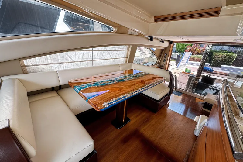 Ll On The Rocks Yacht Photos Pics Luxurious interior of 2012 Azimut Fly 53 yacht with elegant seating and custom table.