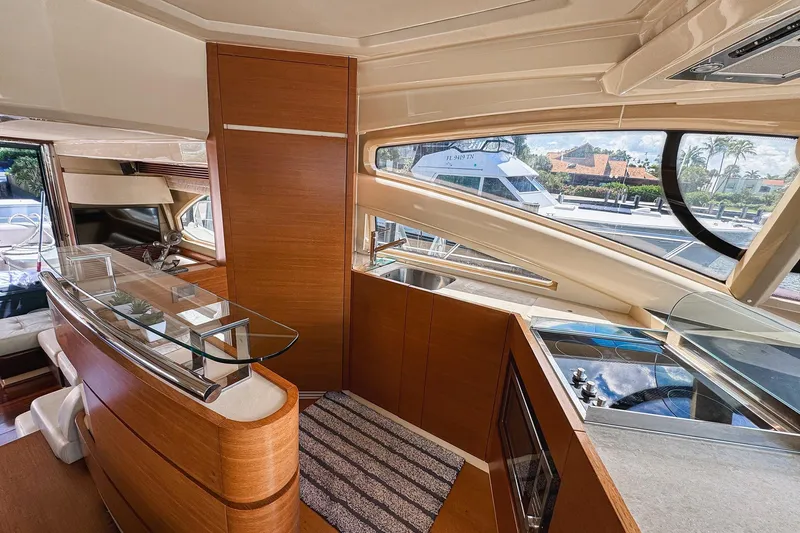 Ll On The Rocks Yacht Photos Pics Luxurious interior of 2012 Azimut Fly 53 yacht with modern kitchen and sleek design.