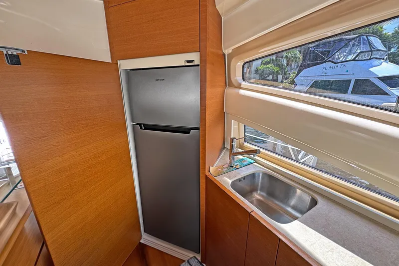 Ll On The Rocks Yacht Photos Pics Modern kitchen area in 2012 Azimut Fly 53 yacht with stainless steel fridge and sink.