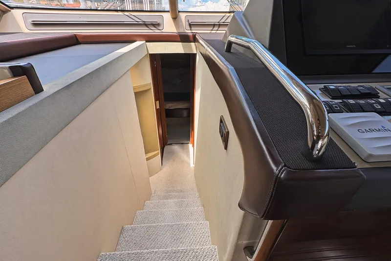 Ll On The Rocks Yacht Photos Pics Interior view of 2012 Azimut Fly 53 yacht, featuring stairs and navigation equipment.