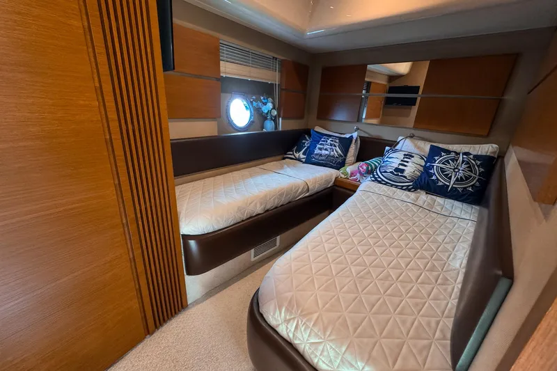 Ll On The Rocks Yacht Photos Pics Luxurious cabin interior of 2012 Azimut Fly 53 yacht with twin beds and nautical decor.