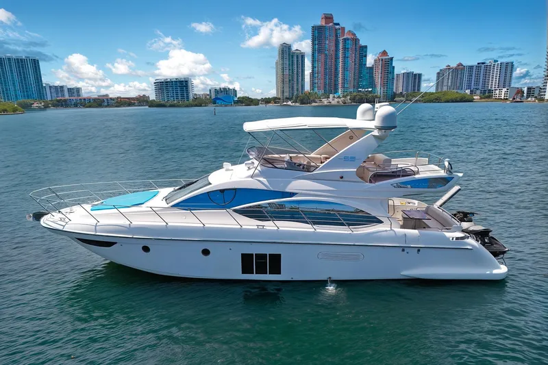Ll On The Rocks Yacht Photos Pics Luxury 2012 Azimut Fly 53 yacht on water with city skyline backdrop.