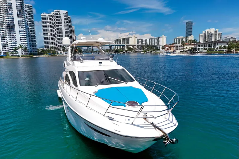 Ll On The Rocks Yacht Photos Pics Azimut Fly 53 yacht cruising near modern city skyline, 2012 model.