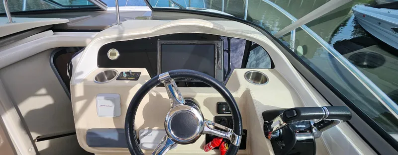  Yacht Photos Pics 2018 Regal 33 XO boat dashboard with steering wheel and control panel.