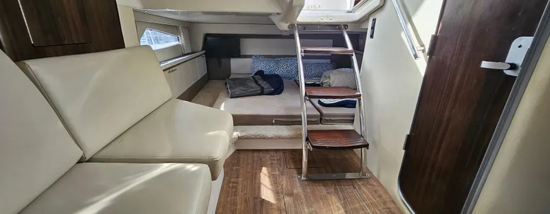  Yacht Photos Pics Interior of 2018 Regal 33 XO yacht with seating and wooden flooring.