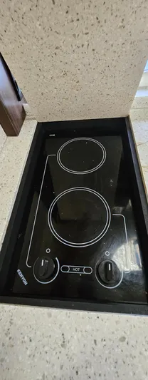  Yacht Photos Pics Built-in stovetop on 2018 Regal 33 XO boat, featuring dual burners.