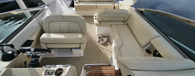  Yacht Photos Pics 2018 Regal 33 XO boat interior with beige seating and steering wheel.