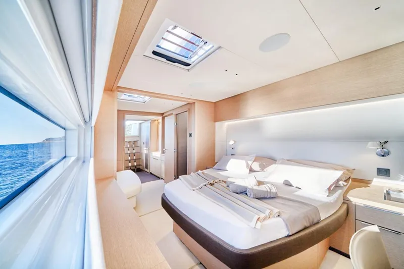 Amada Mia Yacht Photos Pics Luxurious bedroom interior of 2021 Lagoon Sixty5 yacht with ocean view.