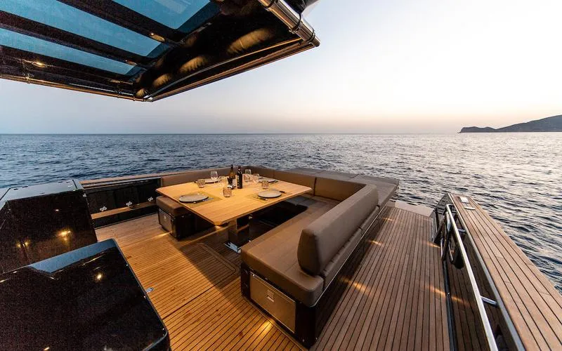  Yacht Photos Pics Luxury Pardo Yachts 50, 2022 model, with elegant deck dining area at sunset.