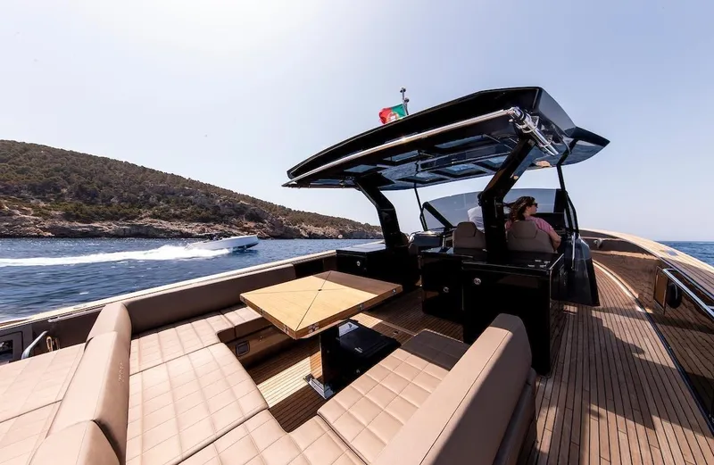  Yacht Photos Pics Luxurious 2022 Pardo Yachts 50 cruising on open water with elegant seating and table.