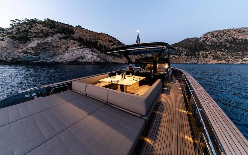 Yacht Photos Pics Luxurious 2022 Pardo Yachts 50 with elegant deck, scenic coastal backdrop at dusk.