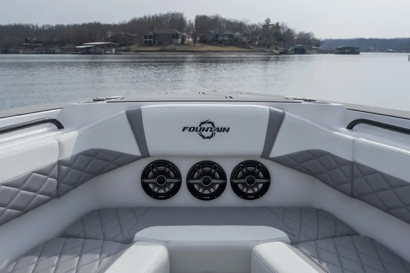 Yacht Photos Pics 2026 Fountain 38 SCX boat interior with speakers, quilted seating, and lake view.
