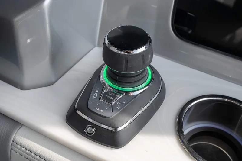  Yacht Photos Pics Joystick control on 2026 Fountain 38 SCX boat dashboard, featuring illuminated buttons.
