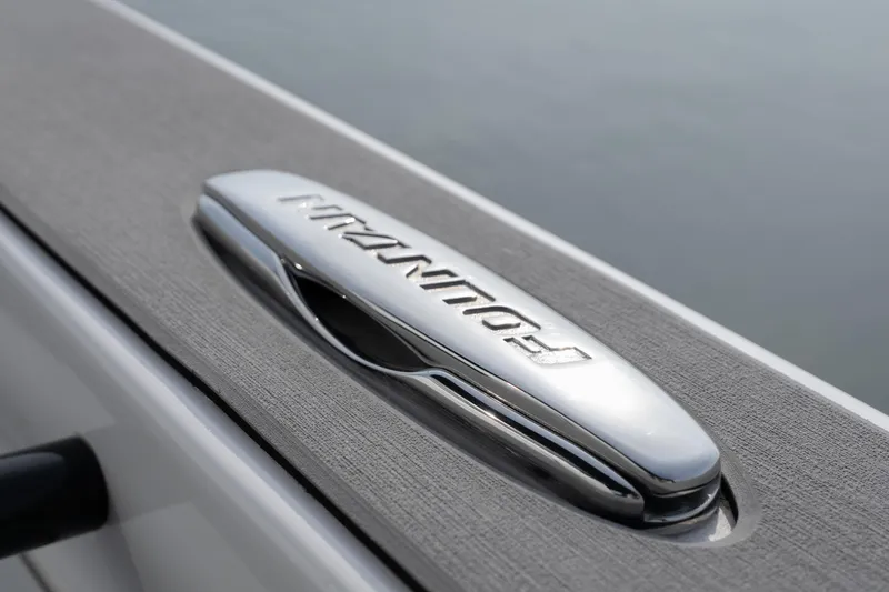  Yacht Photos Pics 2026 Fountain 38 SCX boat emblem on sleek, textured surface.