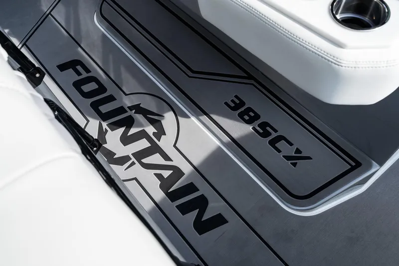  Yacht Photos Pics 2026 Fountain 38 SCX boat interior with logo and cup holder detail.