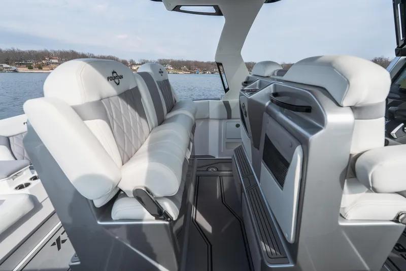 Yacht Photos Pics 2026 Fountain 38 SCX boat interior with luxurious white seating and modern design.