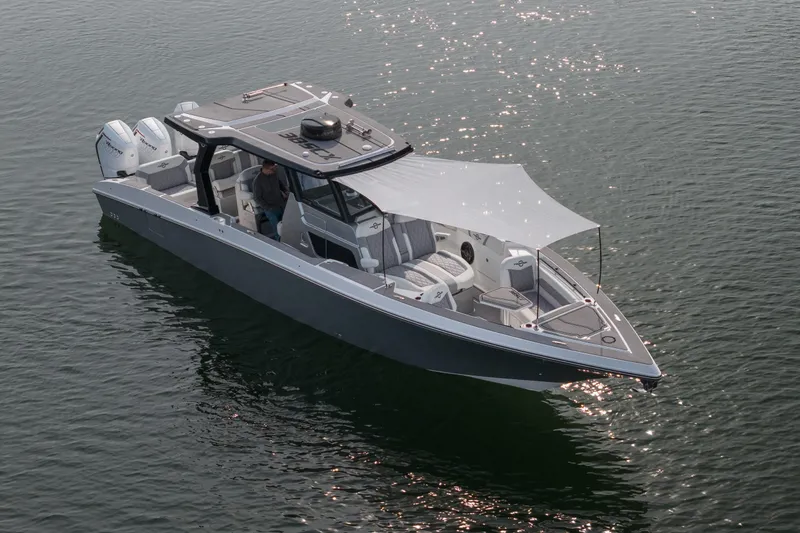  Yacht Photos Pics 2026 Fountain 38 SCX boat on water, featuring sleek design and modern amenities.