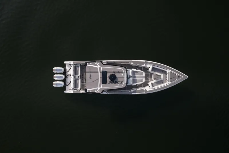  Yacht Photos Pics Top view of 2026 Fountain 38 SCX boat with triple engines on dark water.