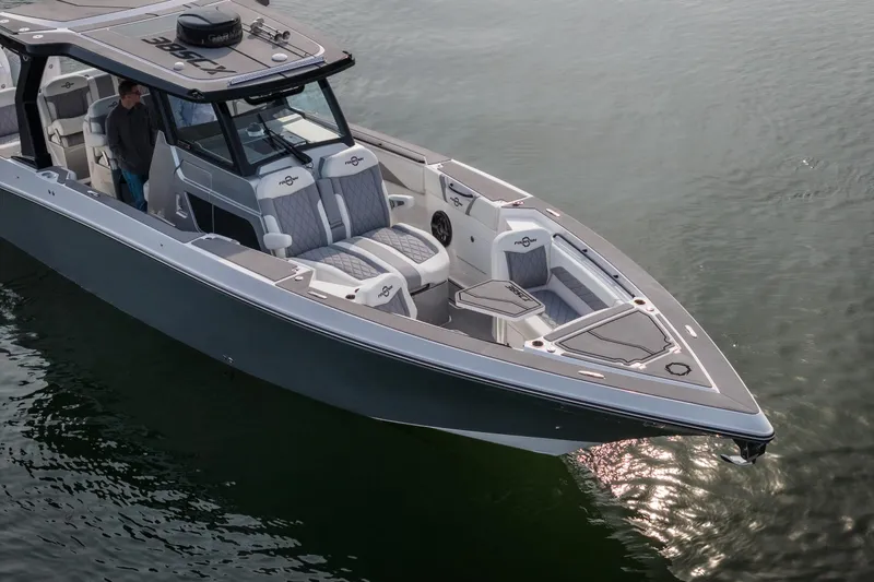  Yacht Photos Pics 2026 Fountain 38 SCX boat on calm water, featuring sleek design and modern seating.