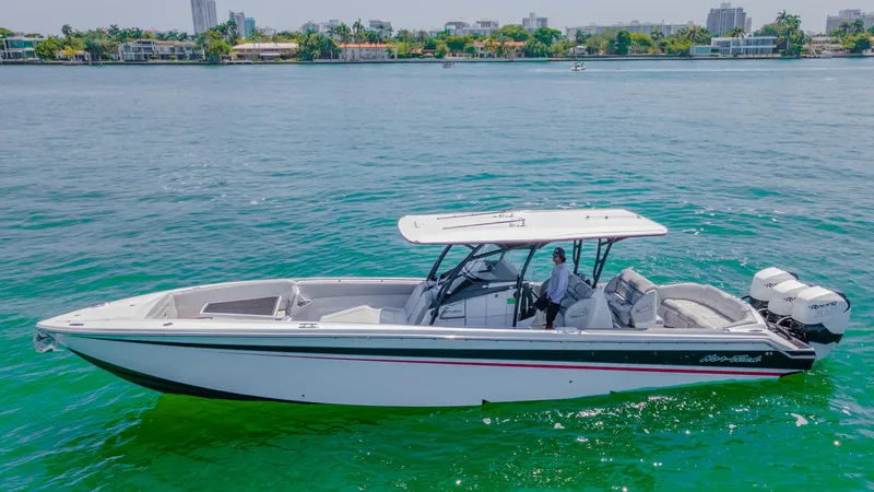  Yacht Photos Pics 2019 Nor-Tech 390 Sport boat cruising on clear blue water.