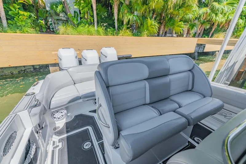  Yacht Photos Pics 2019 Nor-Tech 390 Sport boat interior with plush seating and triple engines.