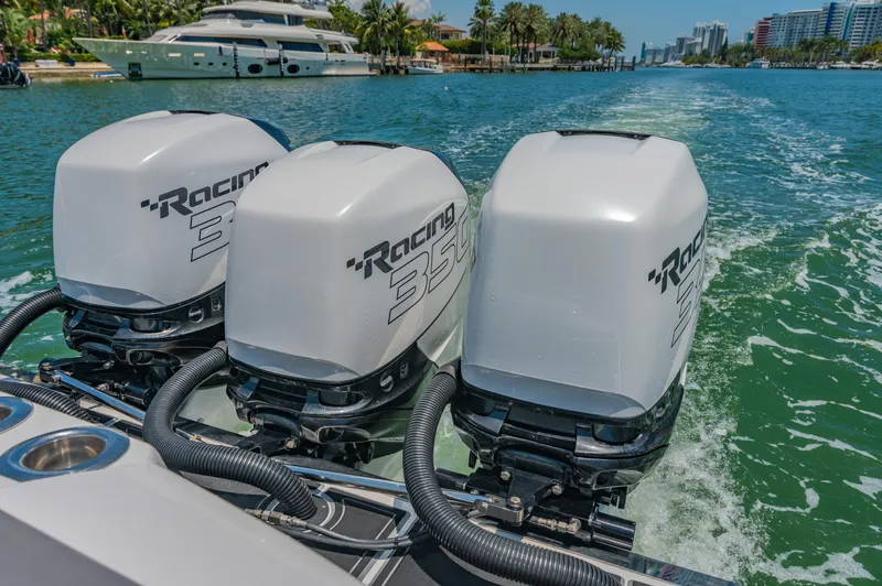  Yacht Photos Pics 2019 Nor-Tech 390 Sport boat with triple Racing engines cruising on a scenic waterway.