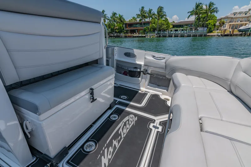  Yacht Photos Pics 2019 Nor-Tech 390 Sport boat interior with luxurious seating and scenic waterfront view.