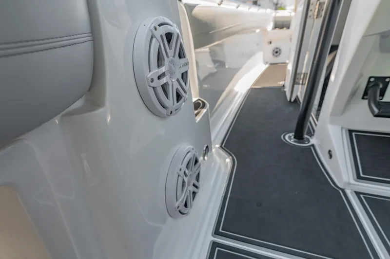  Yacht Photos Pics 2019 Nor-Tech 390 Sport boat interior with dual speakers and sleek flooring.