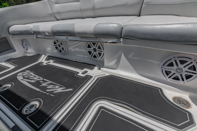  Yacht Photos Pics 2019 Nor-Tech 390 Sport boat interior with cushioned seating and marine speakers.