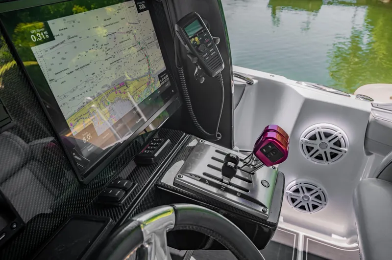  Yacht Photos Pics 2019 Nor-Tech 390 Sport boat cockpit with navigation screen and controls.
