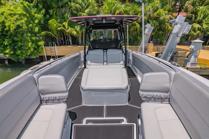  Yacht Photos Pics 2019 Nor-Tech 390 Sport boat interior with spacious seating and sleek design.