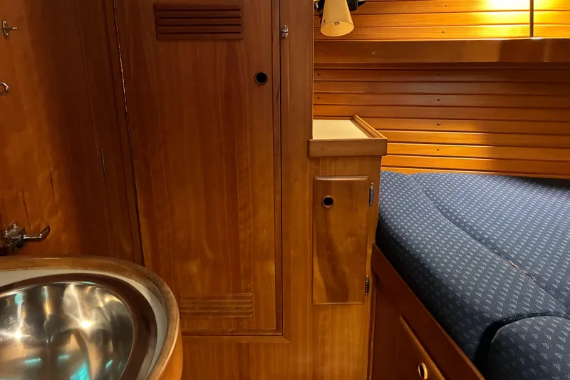 Yacht Photos Pics Wooden interior of 1994 Sabre 362 yacht with sink and cozy bed.