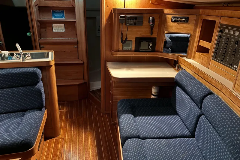  Yacht Photos Pics Interior of a 1994 Sabre 362 yacht with wooden finish and blue upholstery.