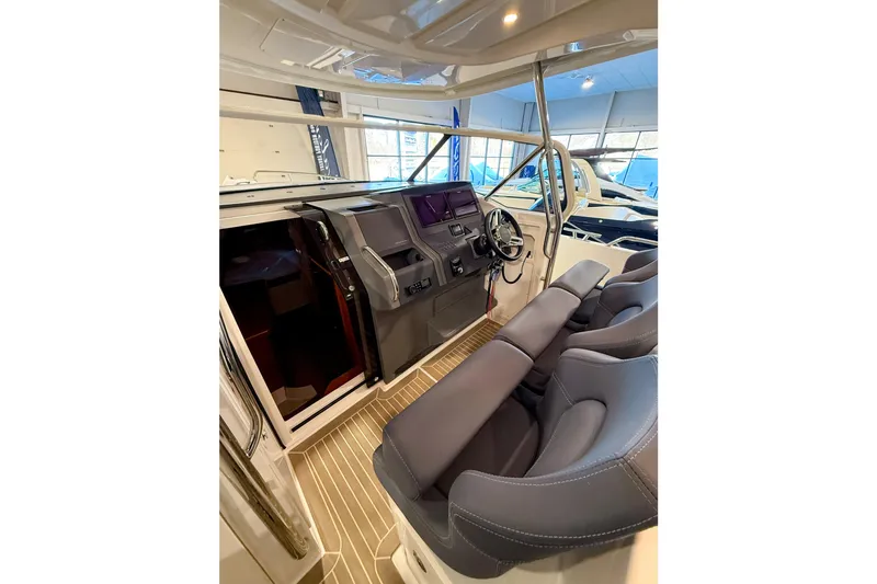  Yacht Photos Pics Interior of 2022 Nimbus T11 boat with modern helm and seating.
