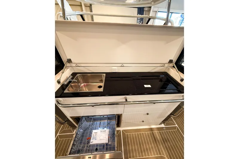  Yacht Photos Pics Modern kitchen setup in 2022 Nimbus T11 boat with sink and stove.