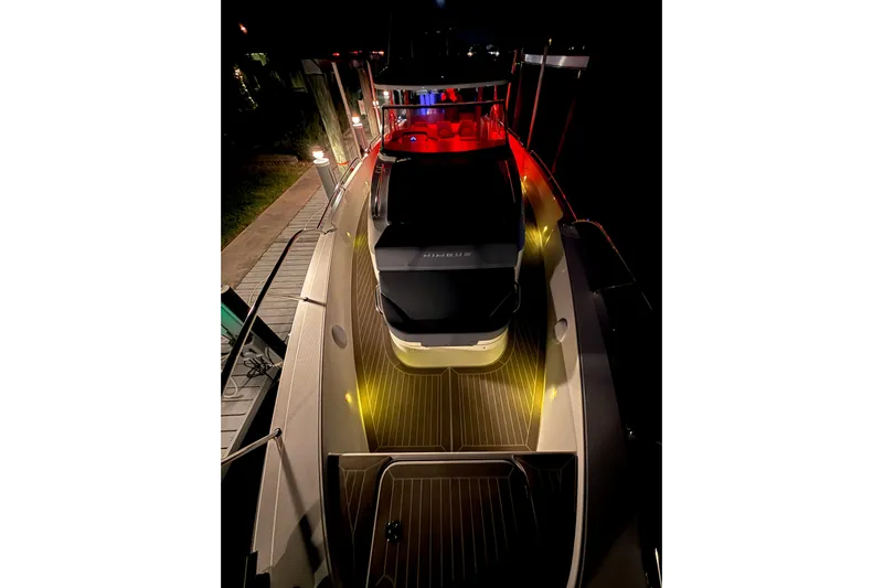  Yacht Photos Pics 2022 Nimbus T11 boat docked at night with ambient lighting.