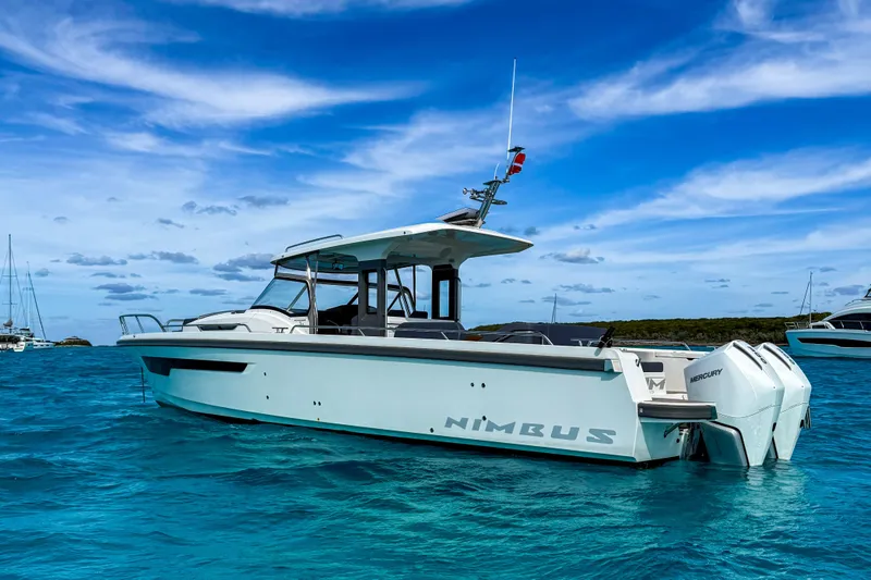  Yacht Photos Pics Nimbus T11 2022 boat on clear blue water under a vibrant sky.