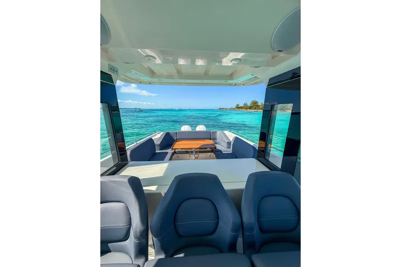 Yacht Photos Pics Luxurious 2022 Nimbus T11 boat interior with ocean view and comfortable seating.