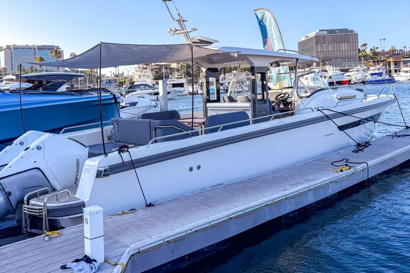  Yacht Photos Pics 2022 Nimbus T11 boat docked at marina, featuring sleek design and modern amenities.