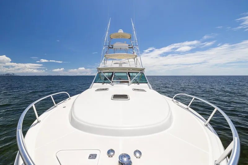 Mutiny Yacht Photos Pics 2004 Tiara Yachts 4200 Open on open water under clear blue sky.