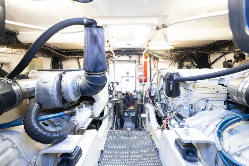 Mutiny Yacht Photos Pics Engine room of a 2004 Tiara Yachts 4200 Open, showcasing mechanical components.