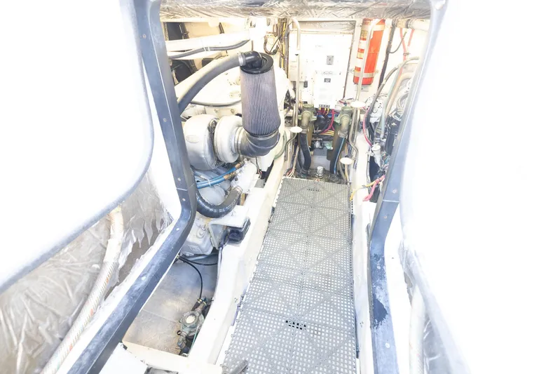 Mutiny Yacht Photos Pics Engine room of a 2004 Tiara Yachts 4200 Open, showcasing mechanical components.